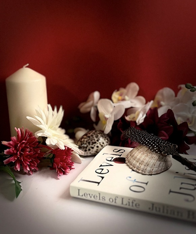 A book with shells and flowers