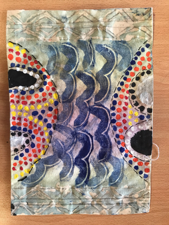 Image of a year 8 student placemat work using various techniques such as press print, dot painting, batik and embroidery – inspired by cultural patterns  