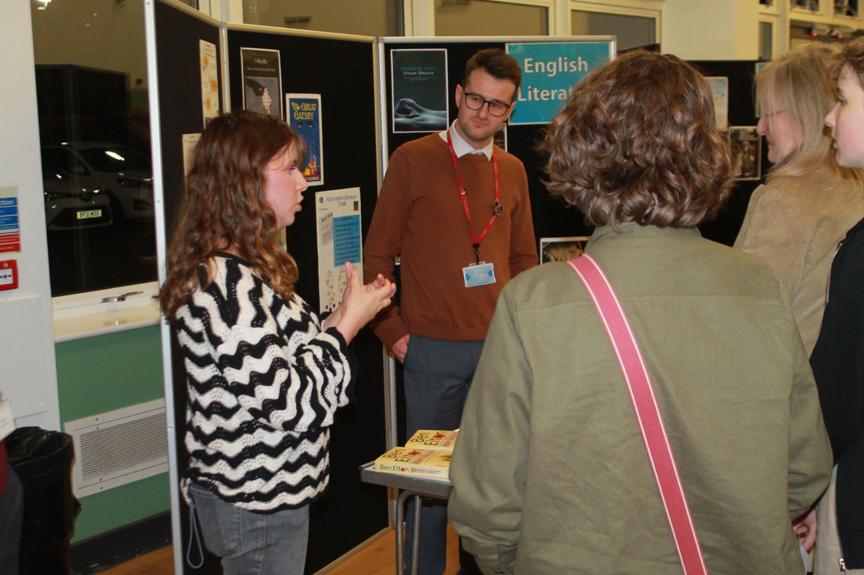 An A Level student talking about English Literature to visitors