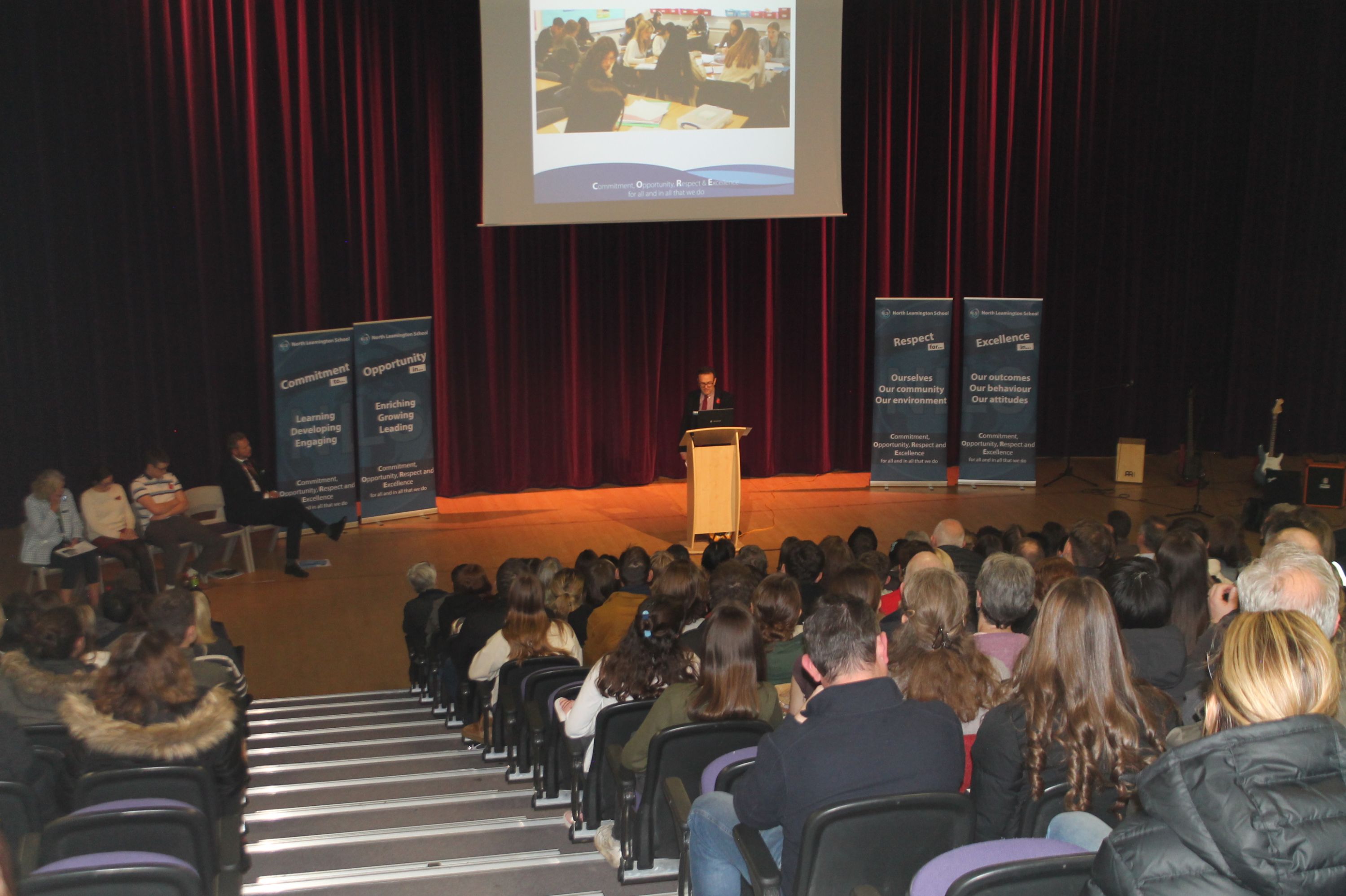 Head of Sixth Form Mr Taylor presenting at the Sixth Form Open Evening in the Theatre