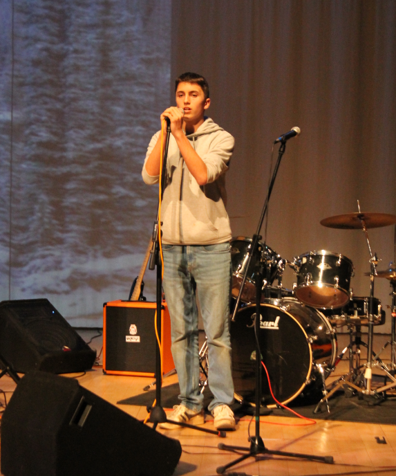 A student performing a solo piece at the music concert