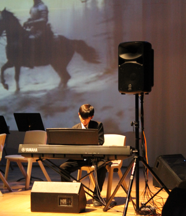 A student performing a solo piece at the music concert