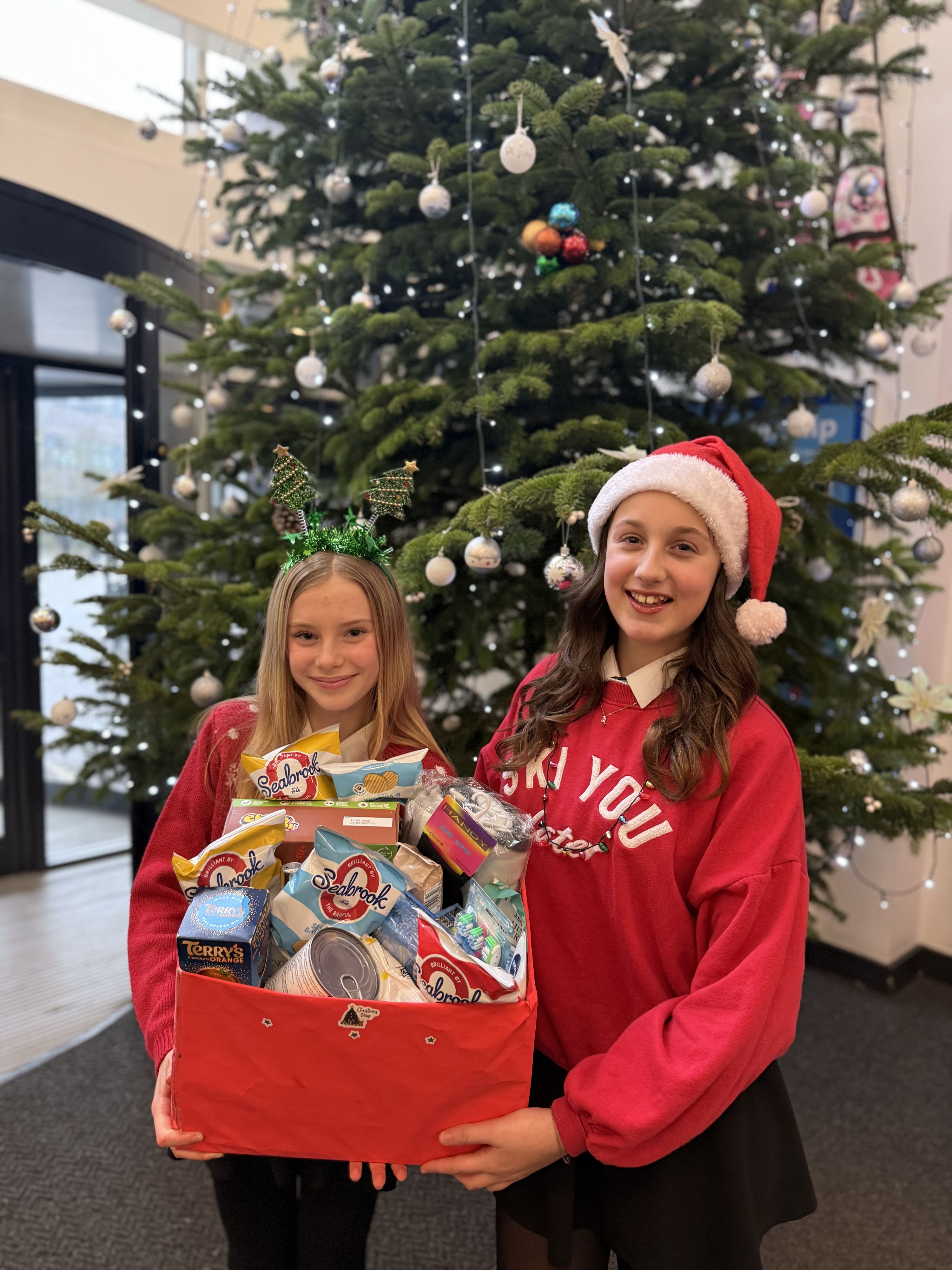 Two students with their Tutor Christmas Hamper 