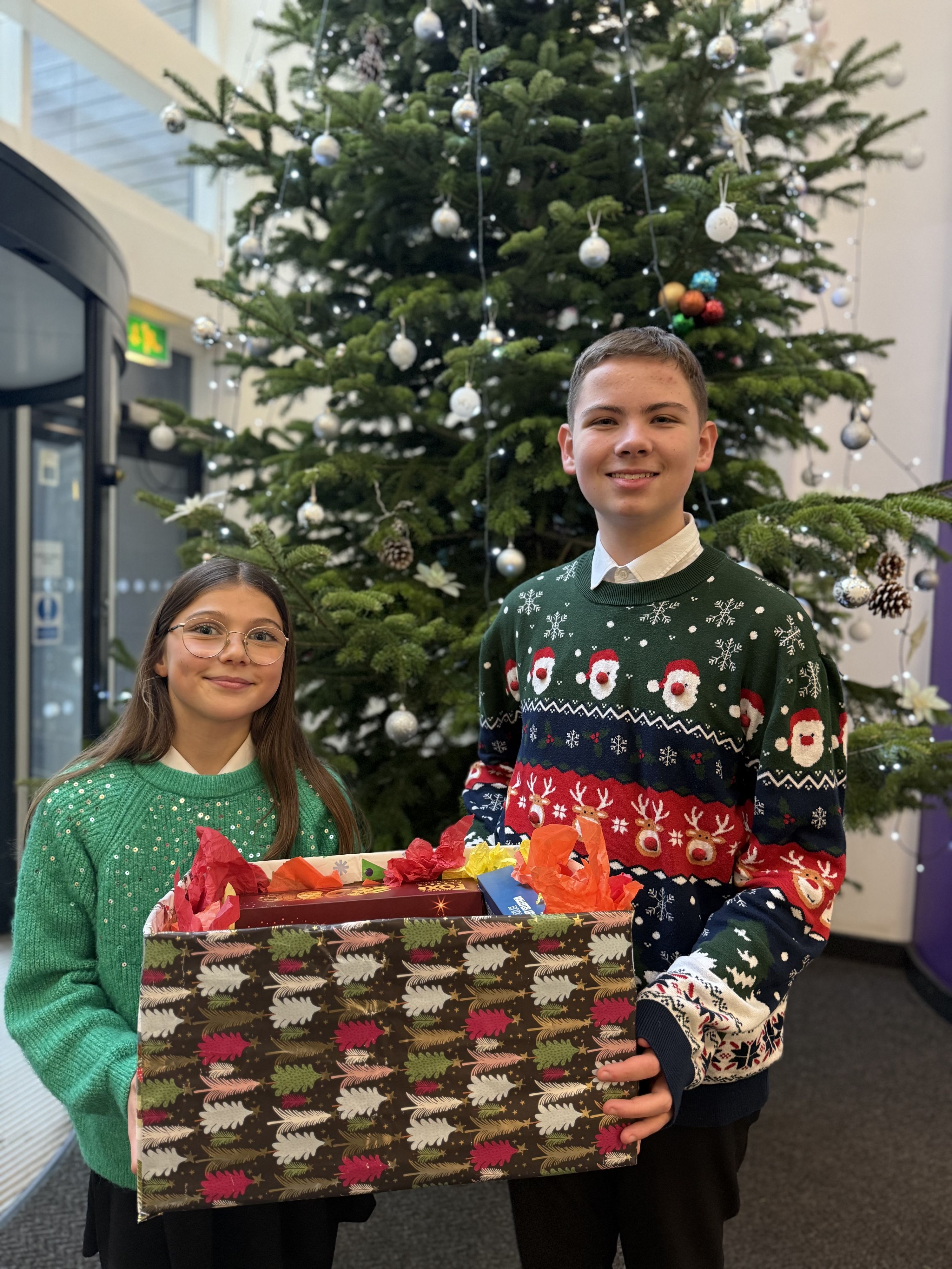 Two students with their Tutor Christmas Hamper 