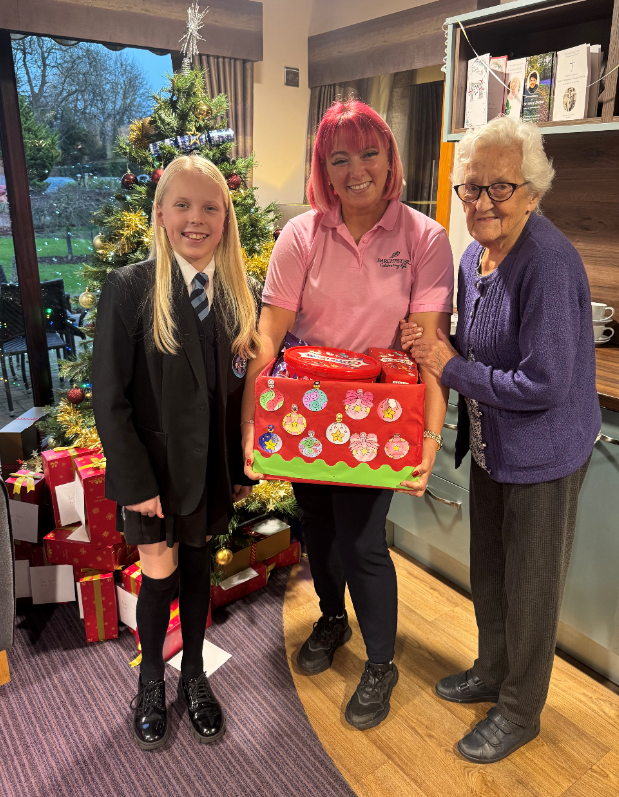 A student delivering a hamper