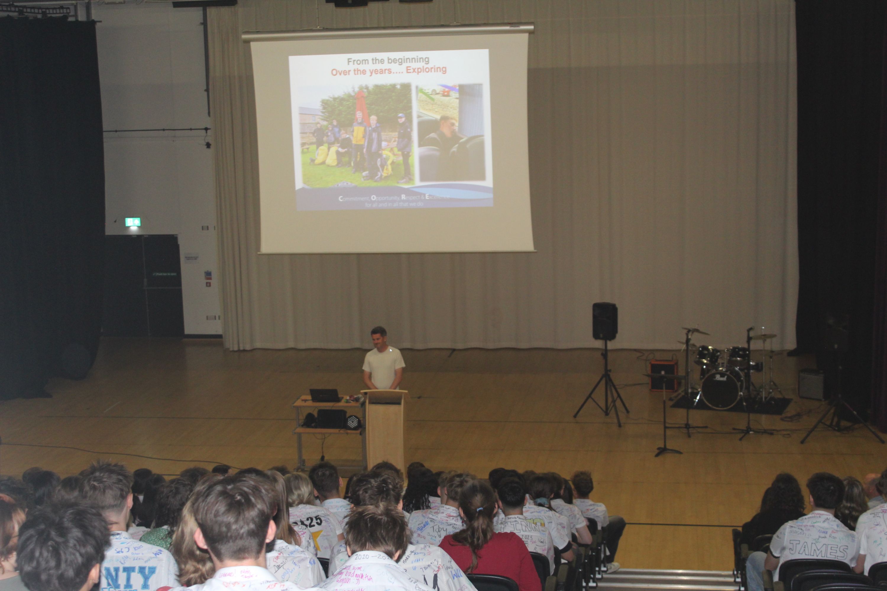students enjoying the assembly in the theatre