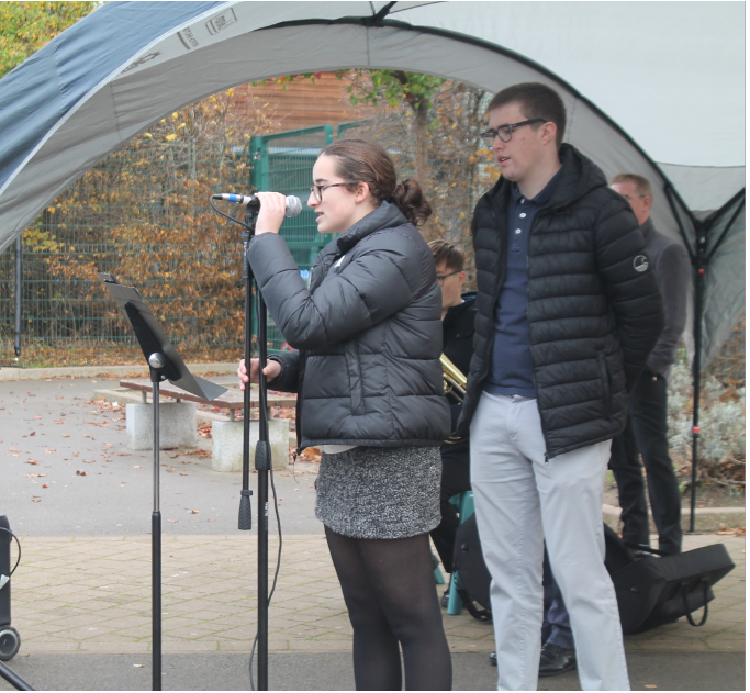 Senior Student Leaders Millie and Will reading a Remembrance poem at the service