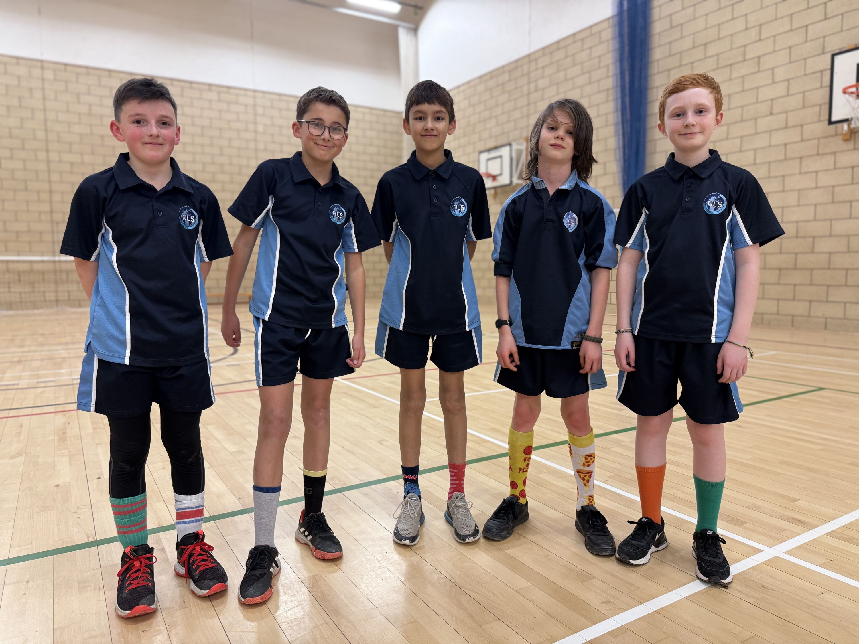 Five students showing their odd socks in support of Anti-Bullying week 