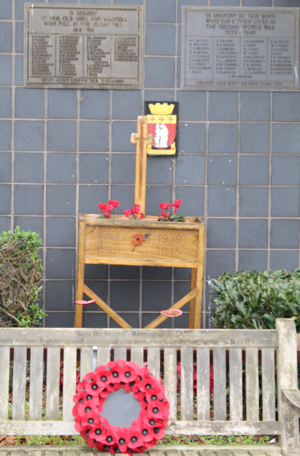 Poppy wreath and memorial of past pupils 