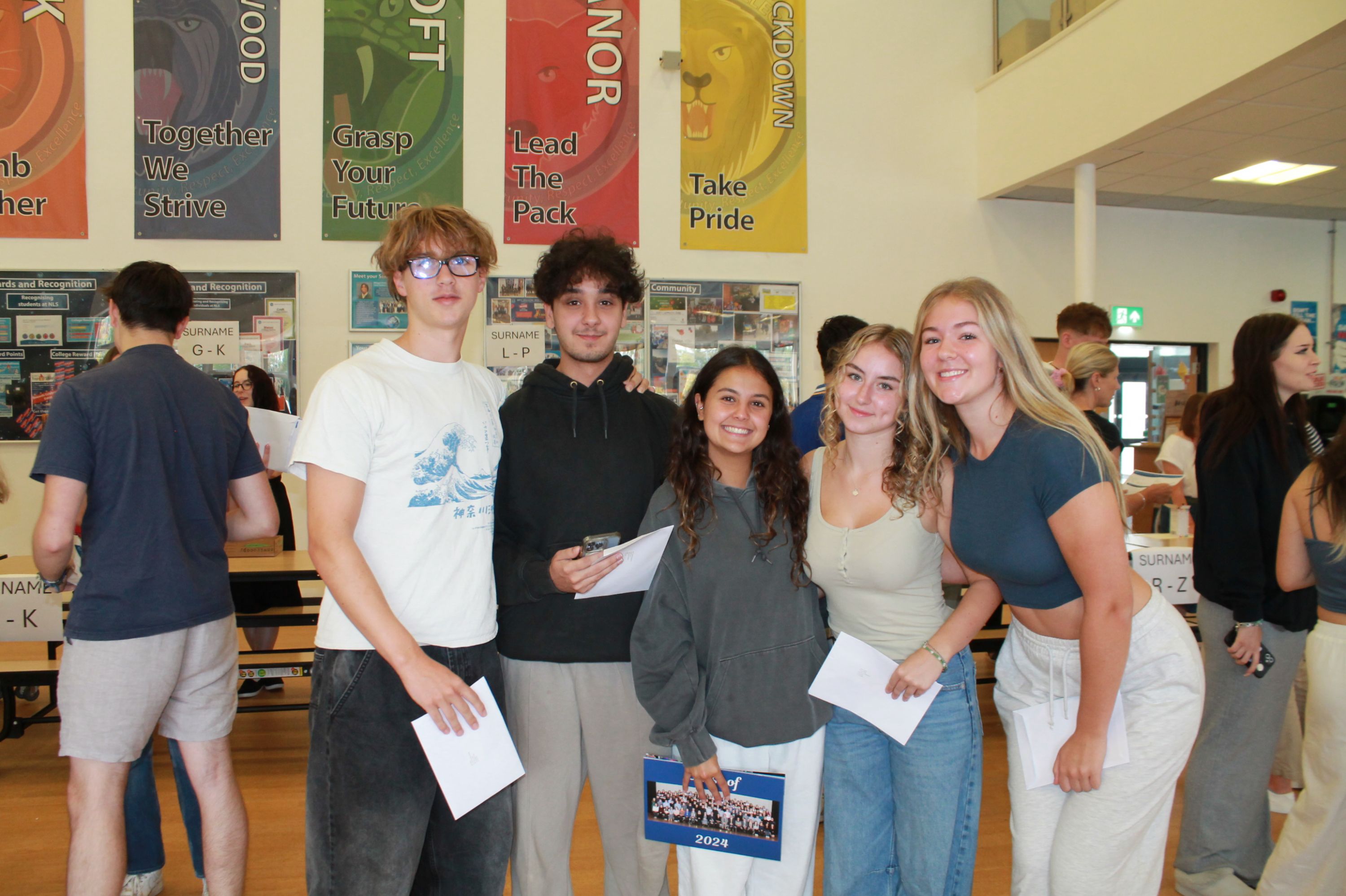 Five  students with their A Level results